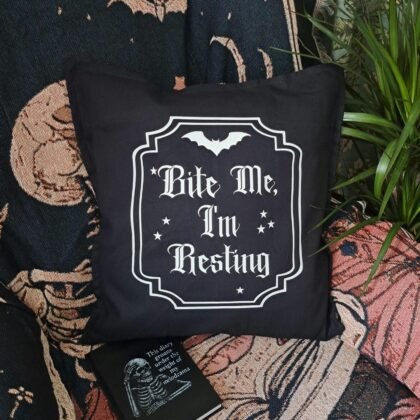 Black gothic cushion cover with Bite Me I’m Resting vampire design in white vinyl