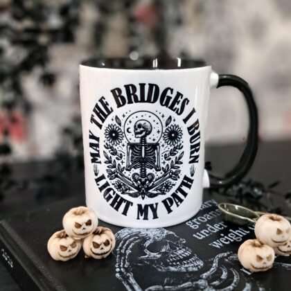 Gothic skeleton mug with “May the bridges I burn light my path” quote and black handle, 11oz ceramic coffee cup