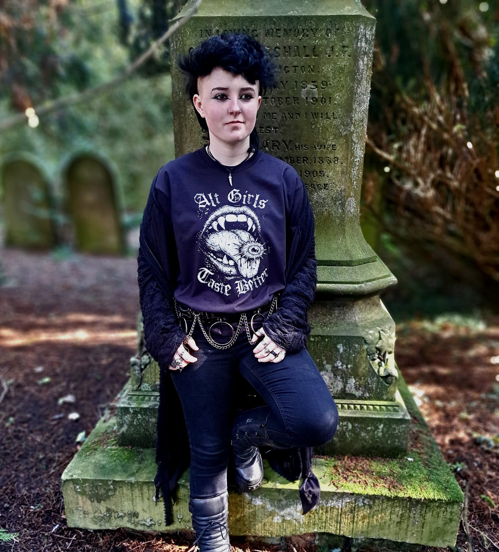 Alternative emo outfit featuring Alt Girls Taste Better graphic t shirt worn with black jeans and chain belt