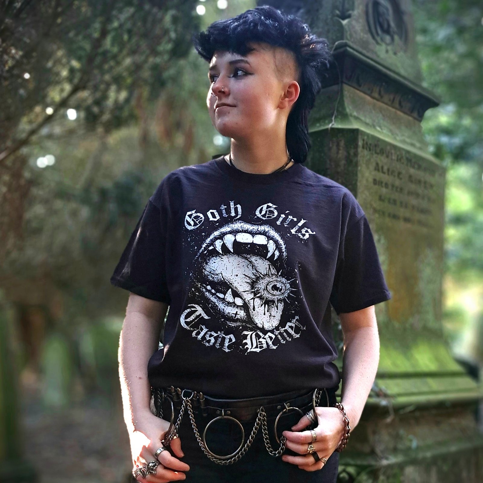 Model wearing Goth Girls Taste Better gothic vampire mouth graphic t shirt printed in white on black cotton tee