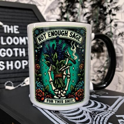 Two tone black and white gothic mug featuring a skeletal hand holding sage with the phrase “Not Enough Sage For This Shit” witchy swear word design.