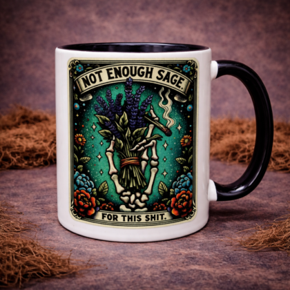 Skeleton hand sage mug with gothic design saying “Not Enough Sage For This Shit” on white ceramic coffee cup with black handle on dark mossy background